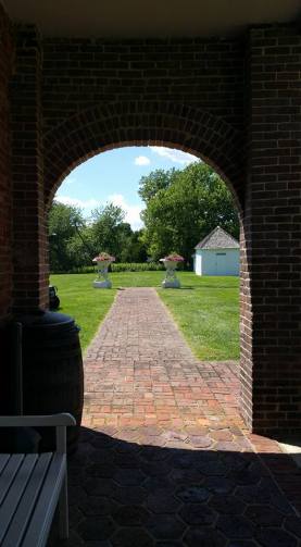 View from the rear walkway of the house, towards the smoke house.